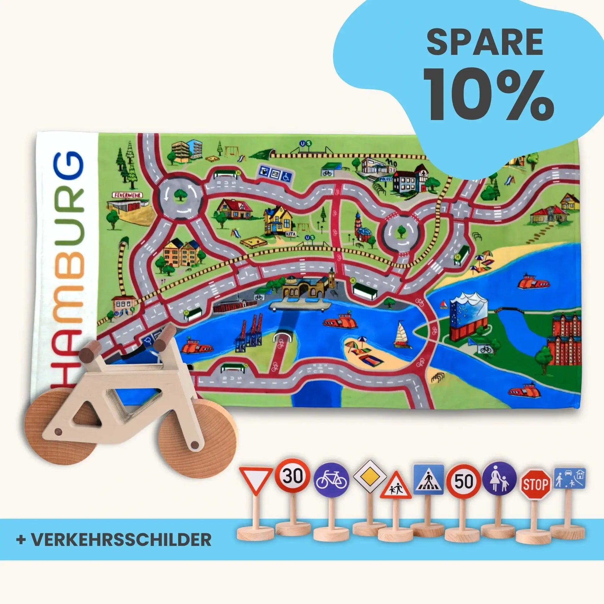 Handtuch Maxi Mobilitätsset To Go mit Spielteppich, Holzfahrrad und Verkehrsschildern für nachhaltige Mobilität.