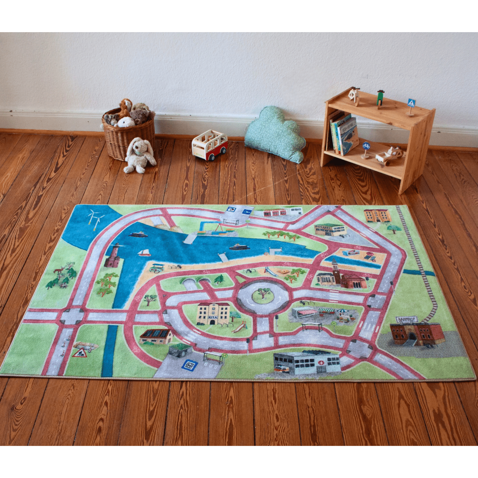 Spielteppich "Stadt von Morgen" mit buntem Stadtbild und Radwegen für Kinder, die Mobilität spielerisch lernen.
