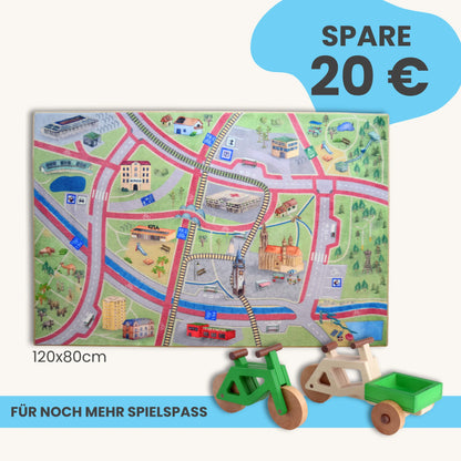 Spielteppich Freiburg 120x80cm im Starter-Set mit bunten Straßen und Spielzeugfahrrädern.